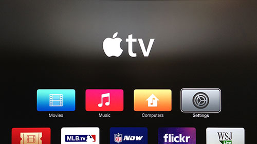 Tela da Apple TV com o botão Ajustes destacado.